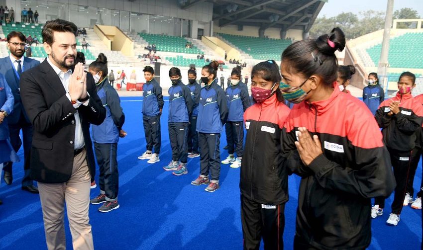  Anurag Singh Thakur interacts with hockey players