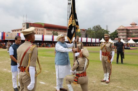 The Union Minister for Home Affairs and Cooperation, Shri Amit Shah presenting the Presidents colour to Assam Police for their exemplary services, in Guwahati on May 10, 2022.