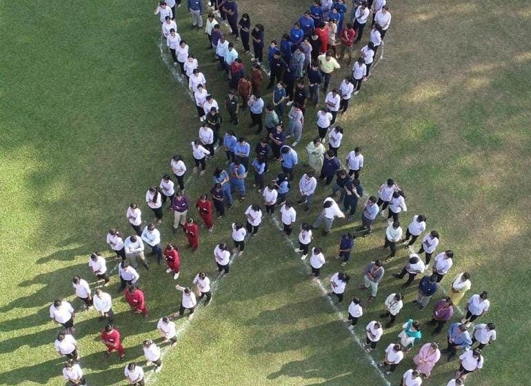  Manipal: Kasturba Hospital’s Human Chain Crafts Iconic Cancer Ribbon for World Cancer Day